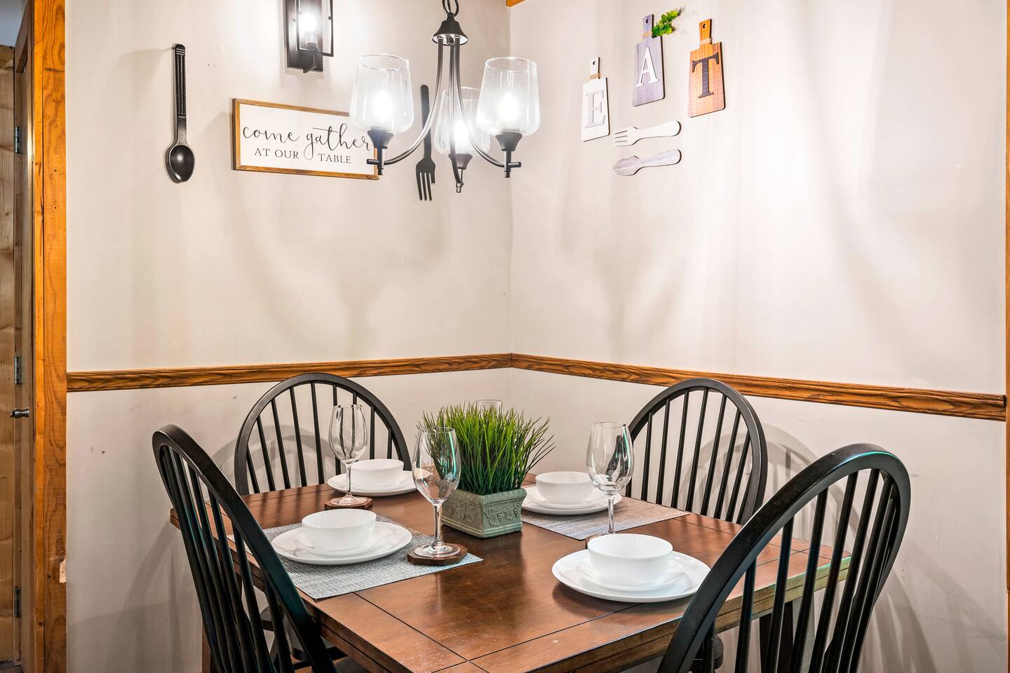 Gather around the cozy dining table, perfect for enjoying home-cooked meals or playing board games. With seating for your group and views of the open living space, it's ideal for creating memorable moments together.