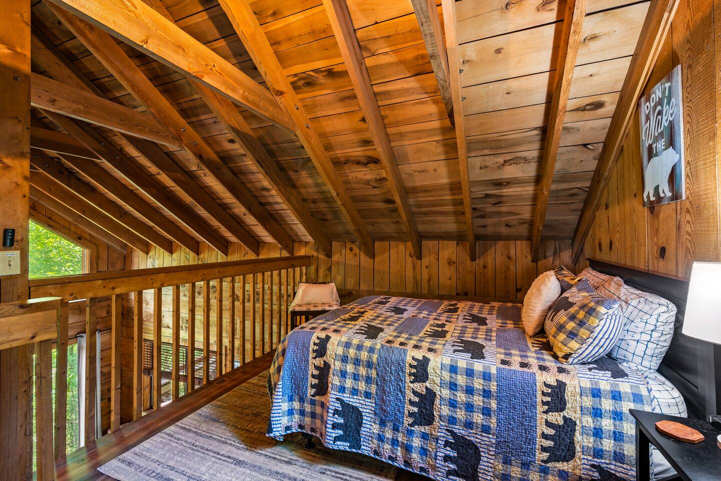 Loft bedroom with a queen bed. Also enjoy the multi-cade and some board games in the loft