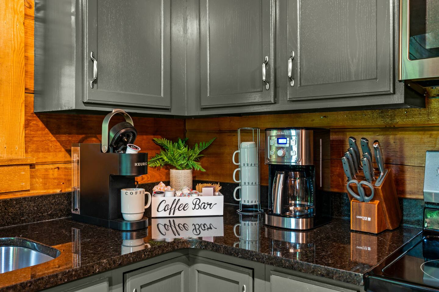 Start your day right at the coffee bar, stocked with a selection of K-Cups and a drip coffee maker. Whether you prefer a quick cup or a freshly brewed pot, this setup ensures you’ll have your caffeine fix ready whenever you need it.
