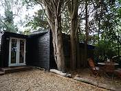 Shaded private courtyard with bistro seating and charming French doors