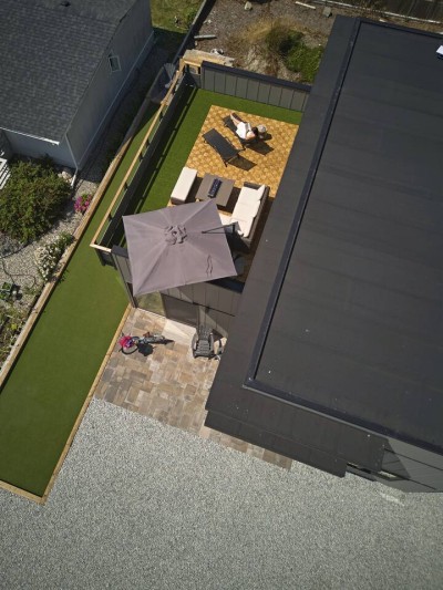 House, rooftop deck and bocce court from above