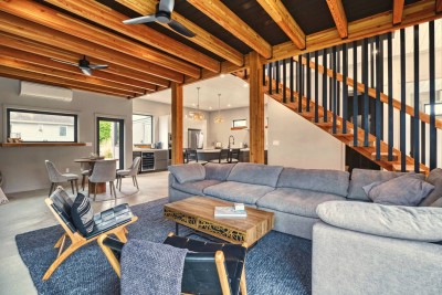Douglas fir beams, the floating staircase and a sofa built for eight