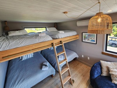 Four double beds: two below, two up top (top bunks for ages 12 and up)