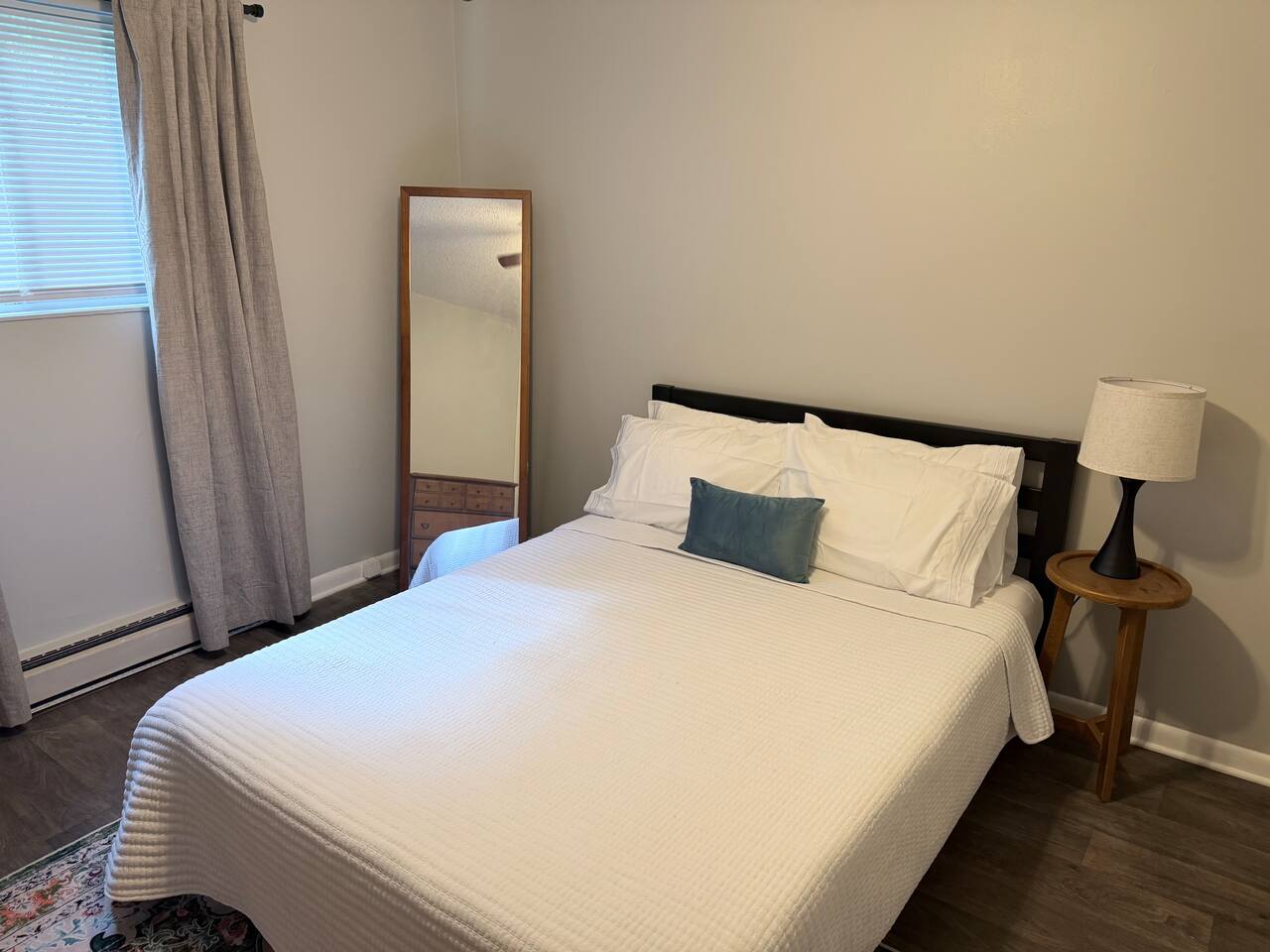 Private bedroom with comfortable queen bed, fresh linens and room to unpack