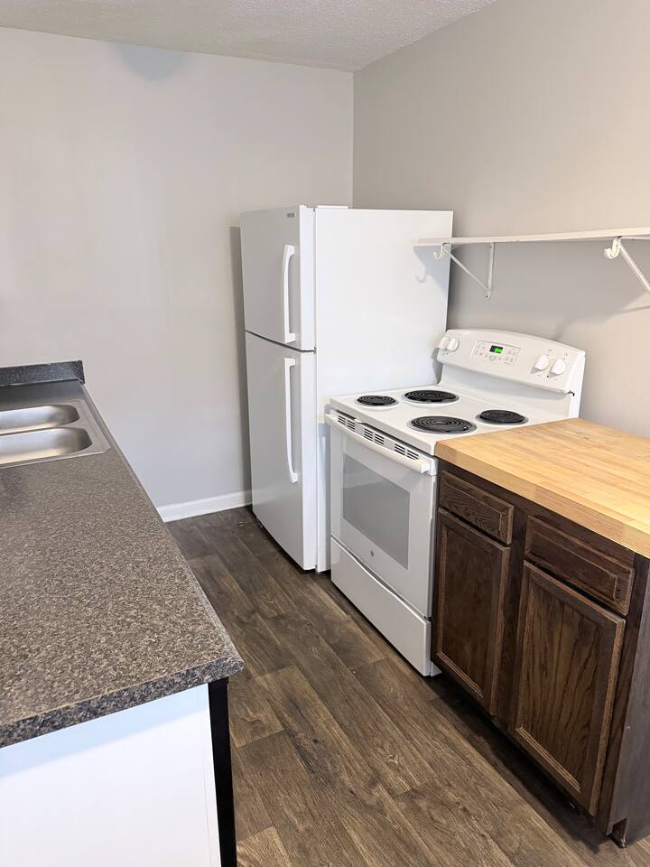 Full-size refrigerator and range make cooking at home easy during longer stays