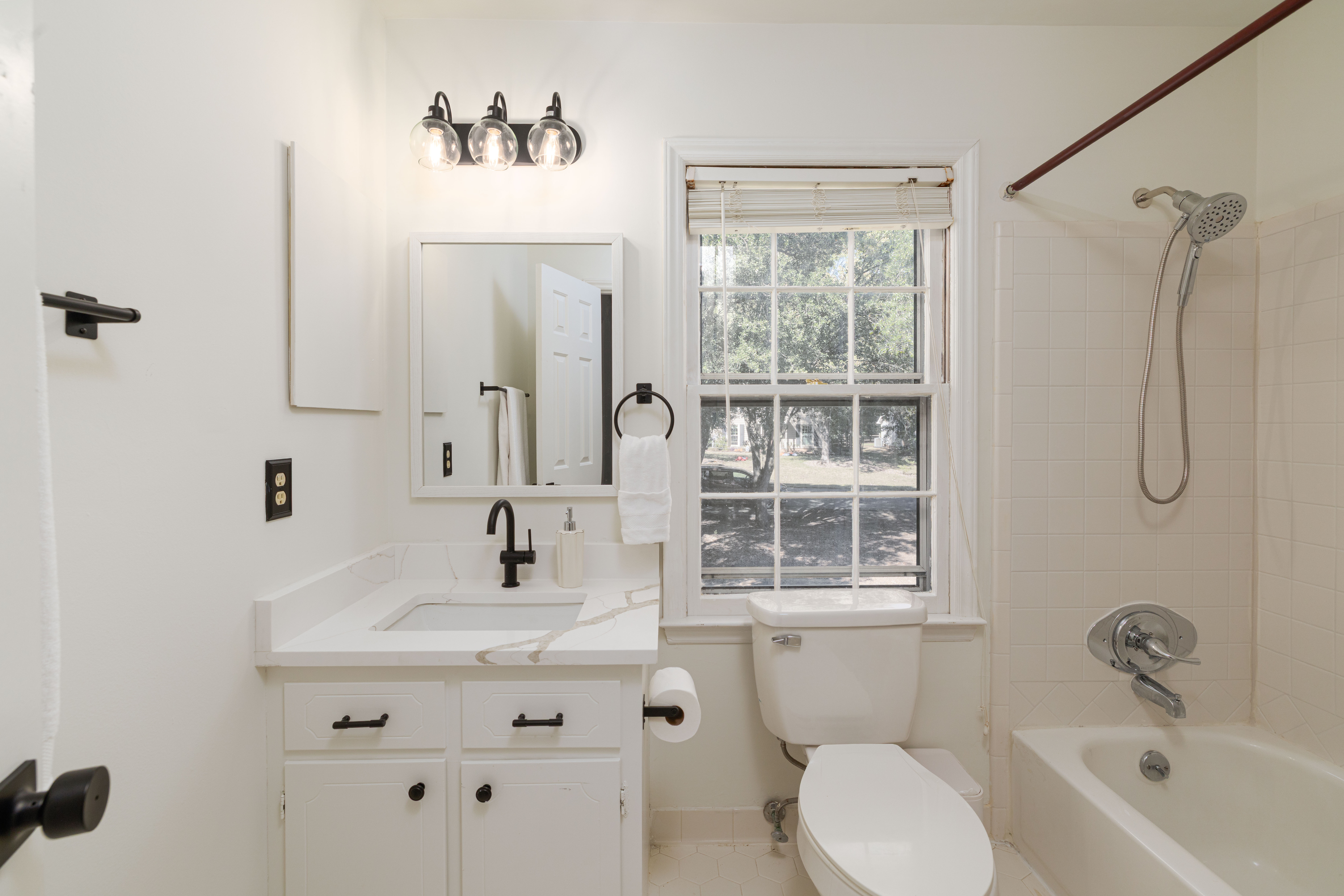 Main House full bath with a tub/shower