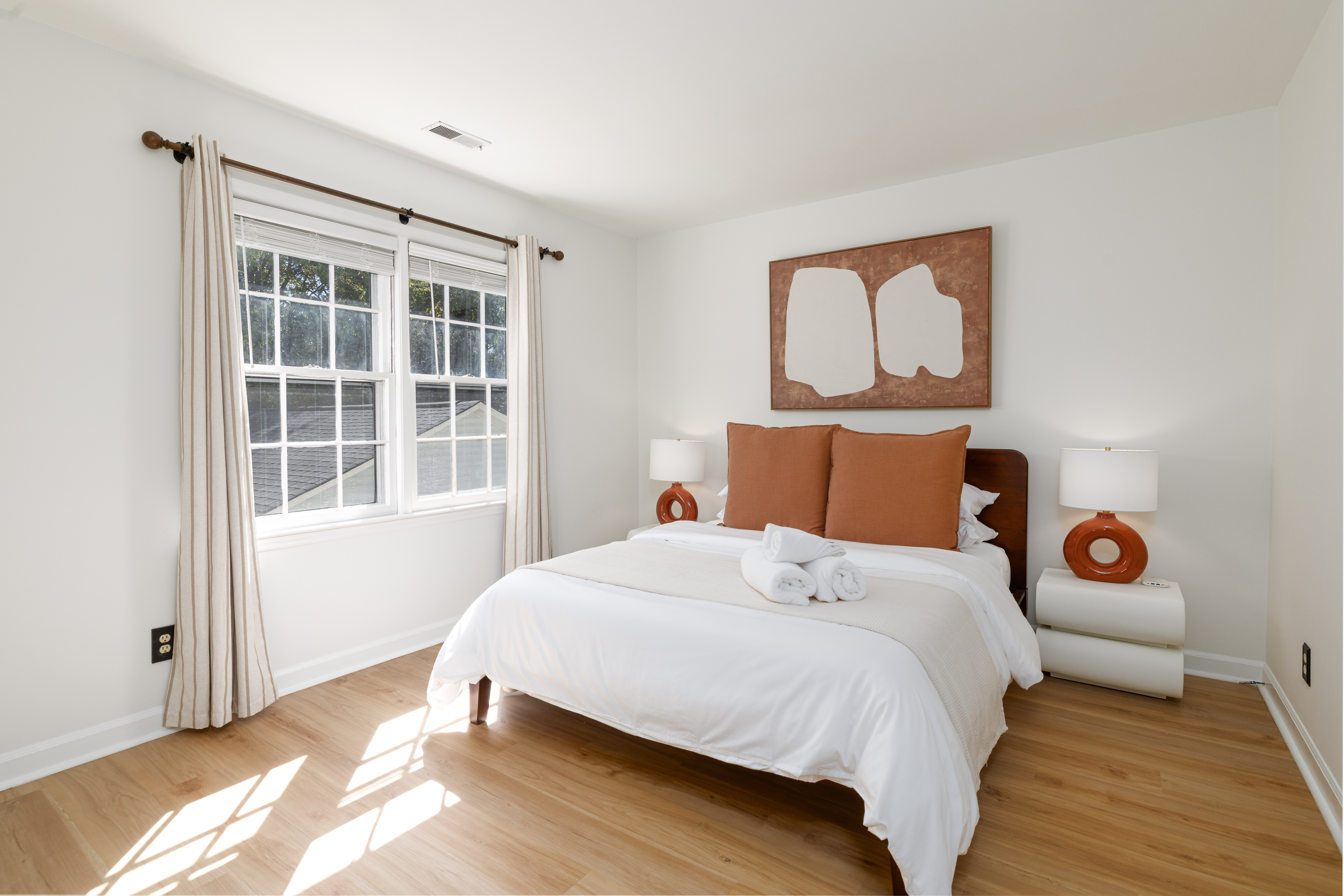 Main House Bedroom 2: queen bed and blackout curtains