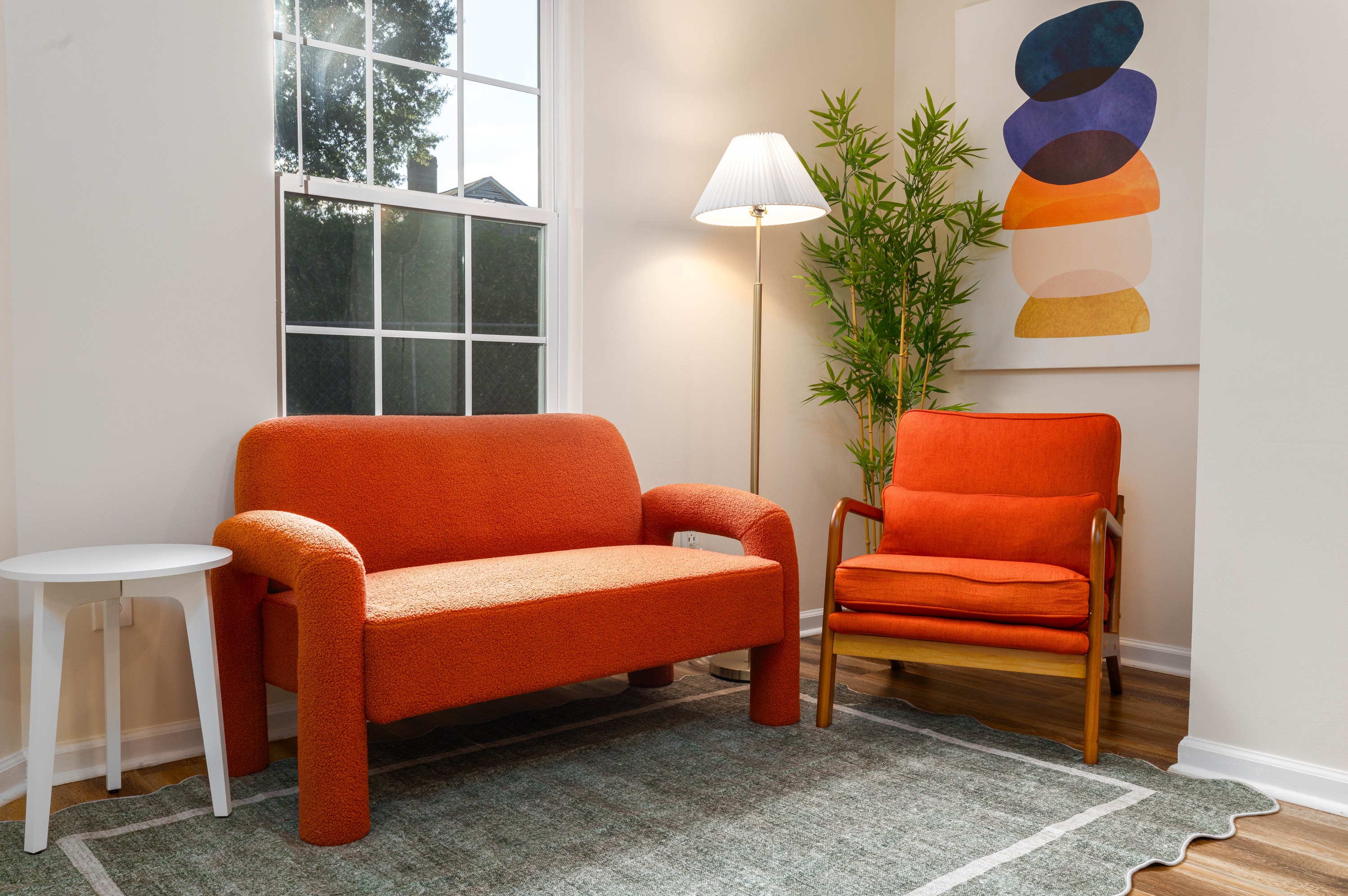 Garden House living room with a loveseat, armchair and floor lamp