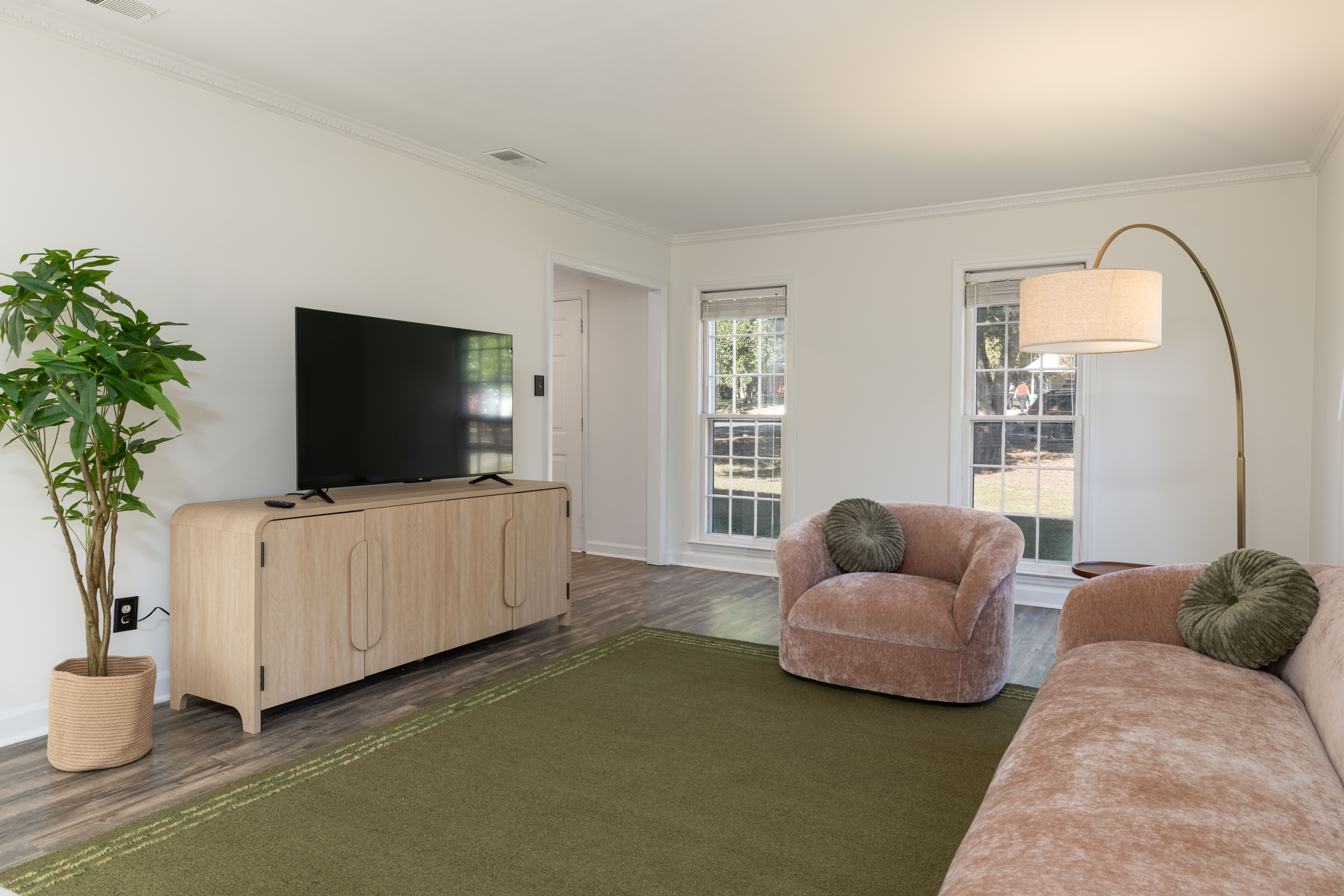 Main House living room with a 55-inch smart TV on an oak console
