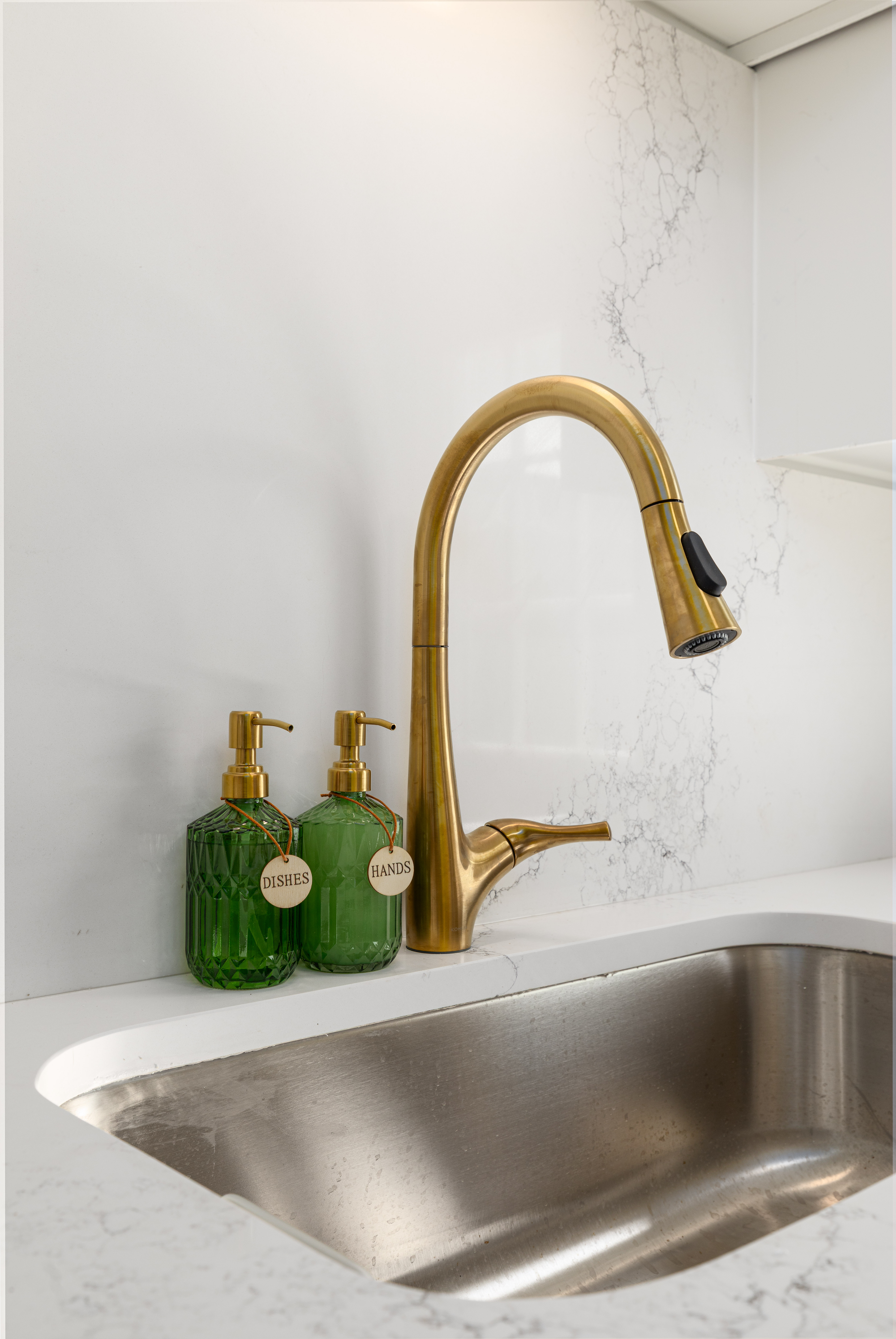 Main House coffee bar sink with a brass faucet