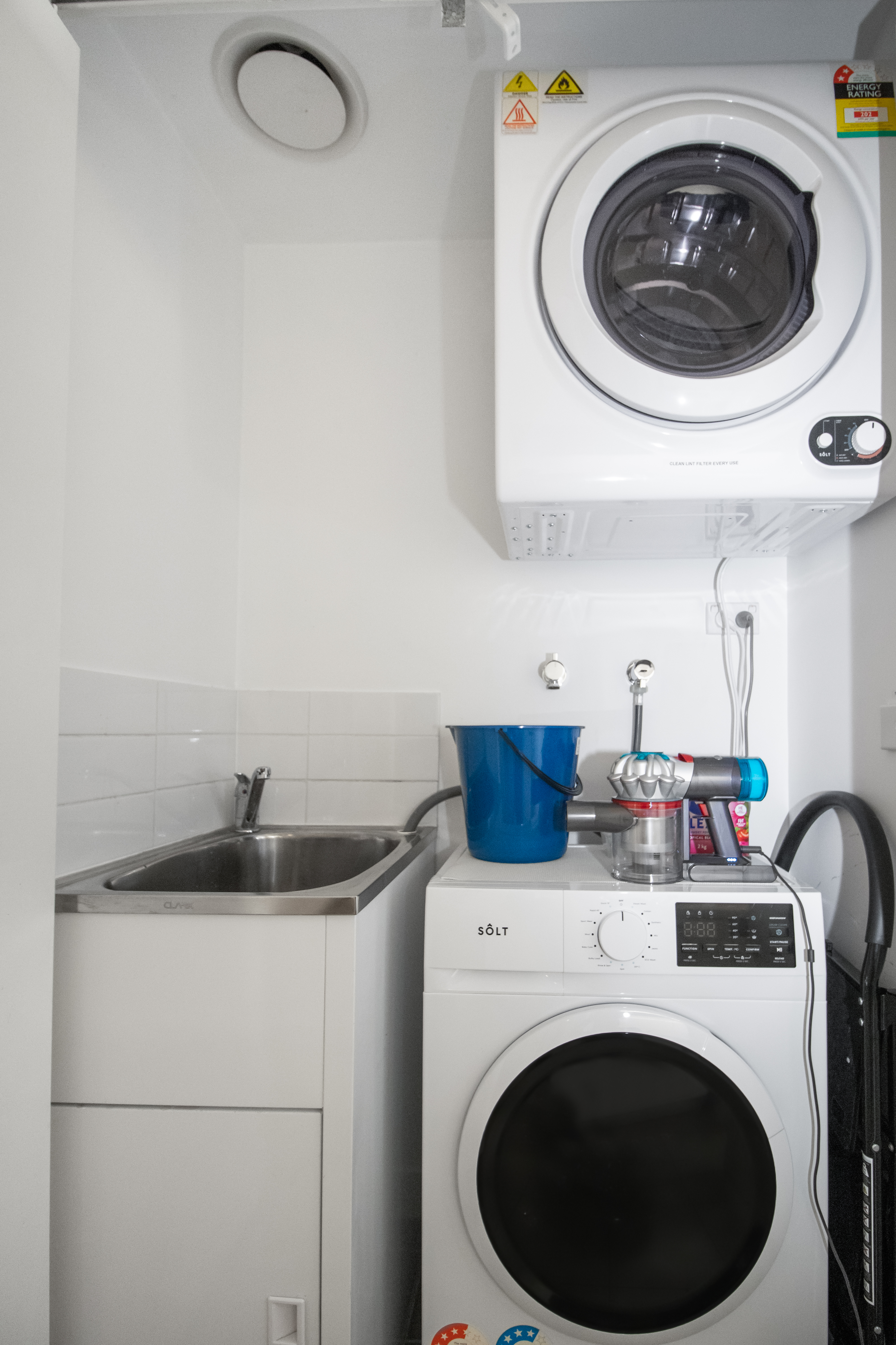 Convenient in-unit laundry with washer, dryer, and utility sink