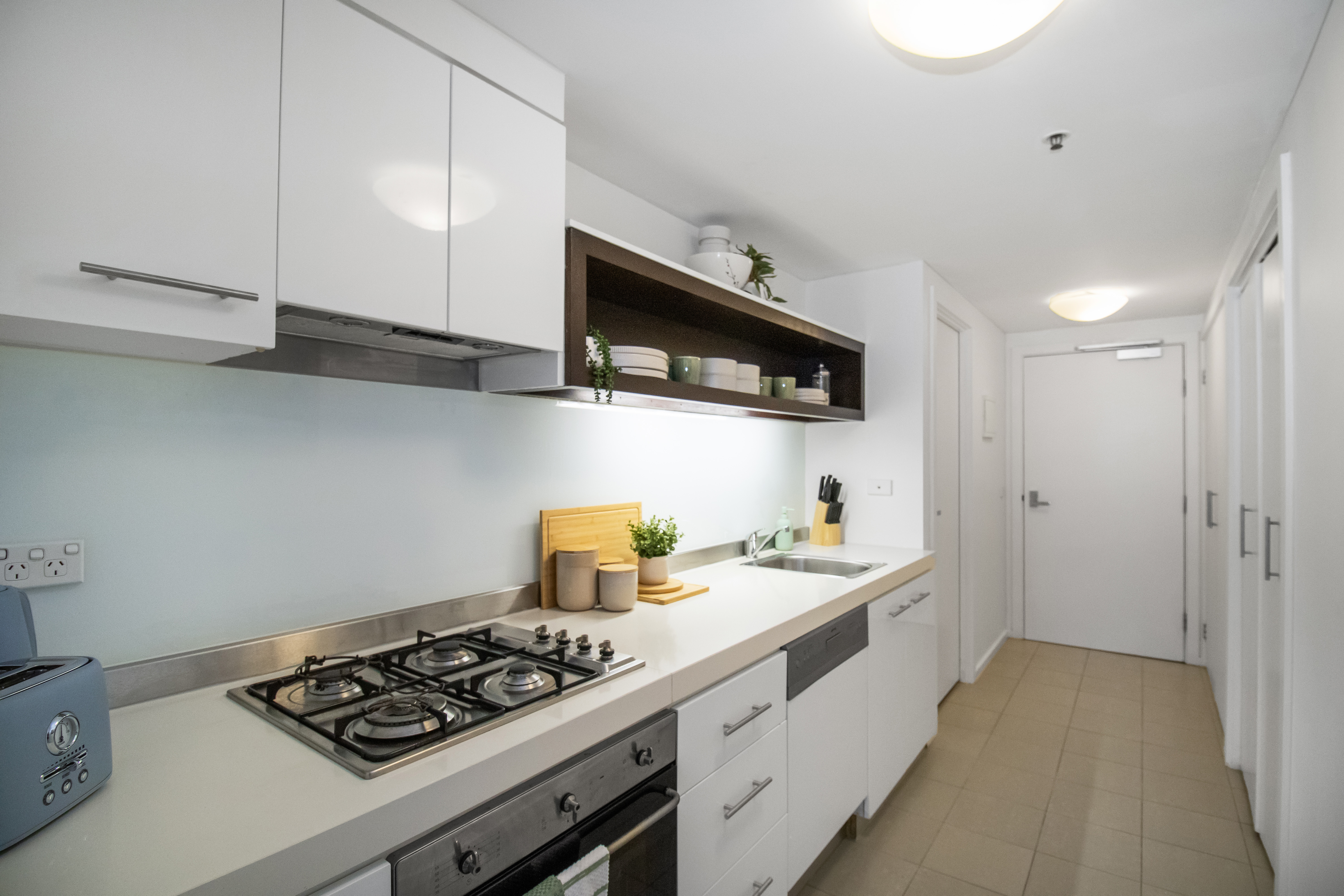Bright modern kitchen with gas cooking and sleek minimalist styling