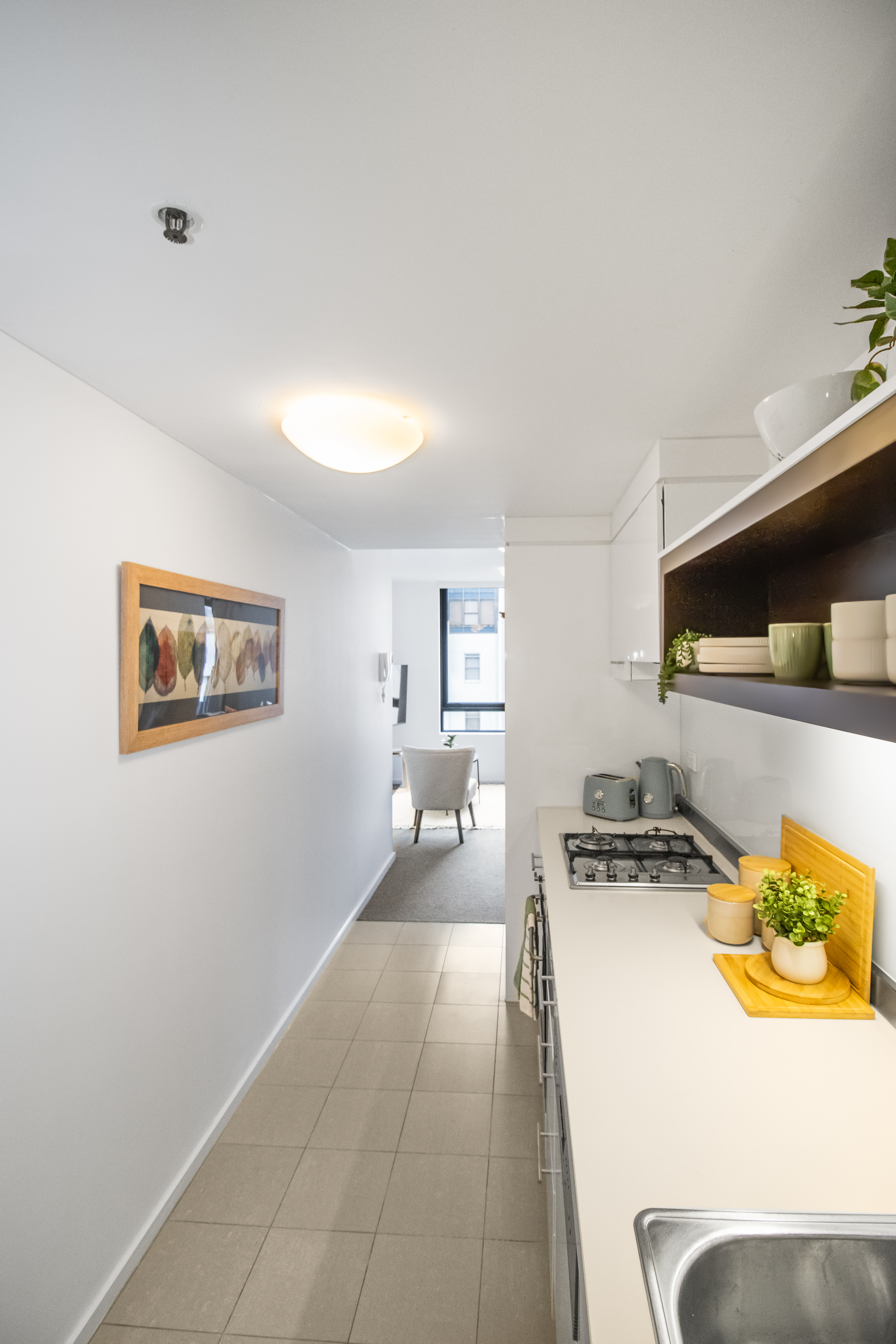 Bright modern galley kitchen with sleek finishes and great prep space