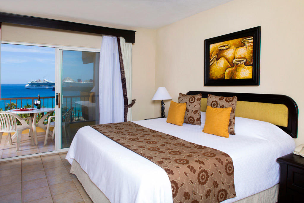 Cozy king room with private balcony and stunning ocean views