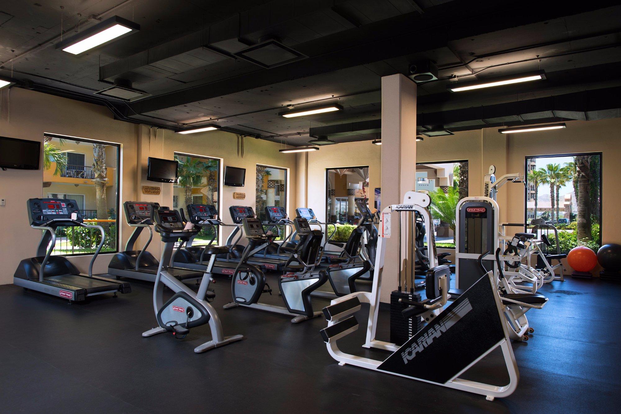 Bright, fully equipped fitness center with cardio and strength machines