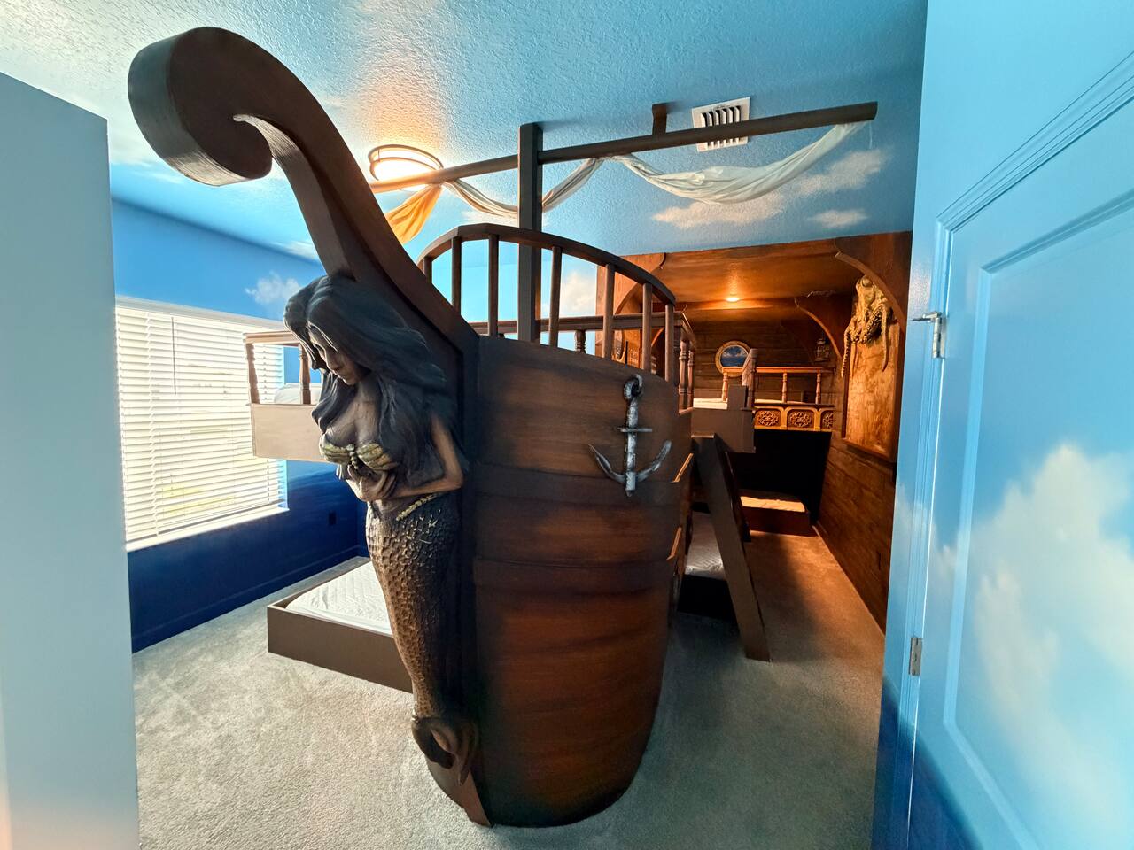 Whimsical pirate ship bedroom with immersive nautical design