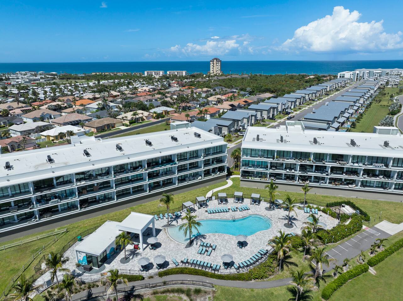 Modern coastal condo with resort-style pool and stunning ocean views