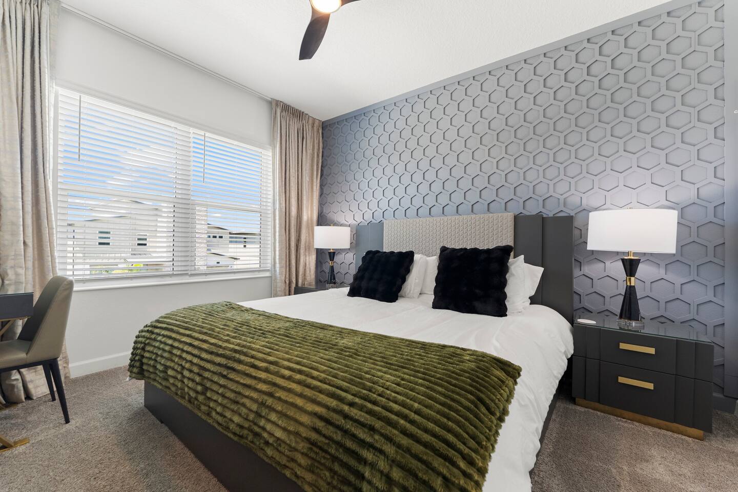Modern king bedroom with designer accent wall and bright natural light