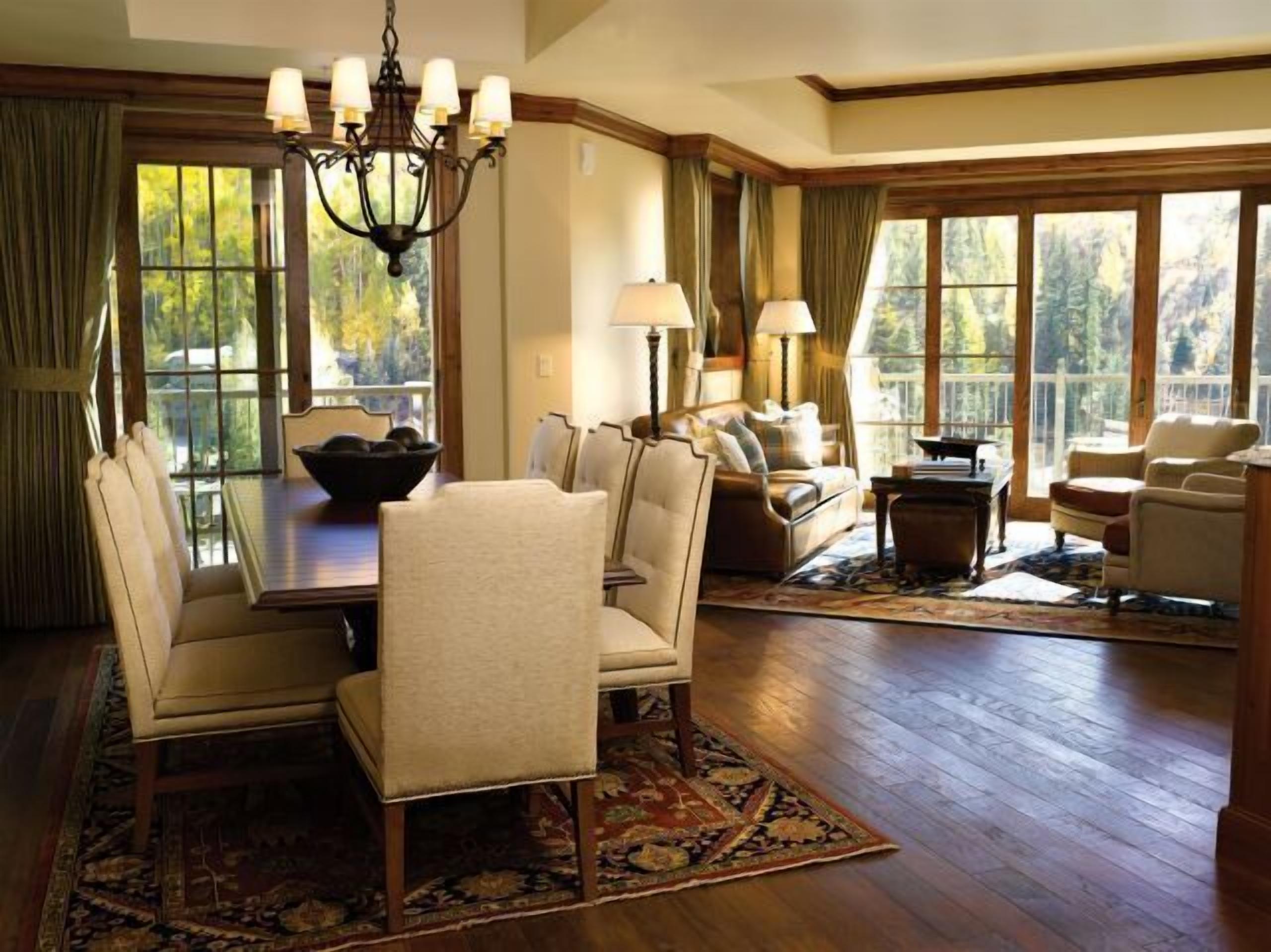 Elegant mountain-view living and dining space with warm natural light