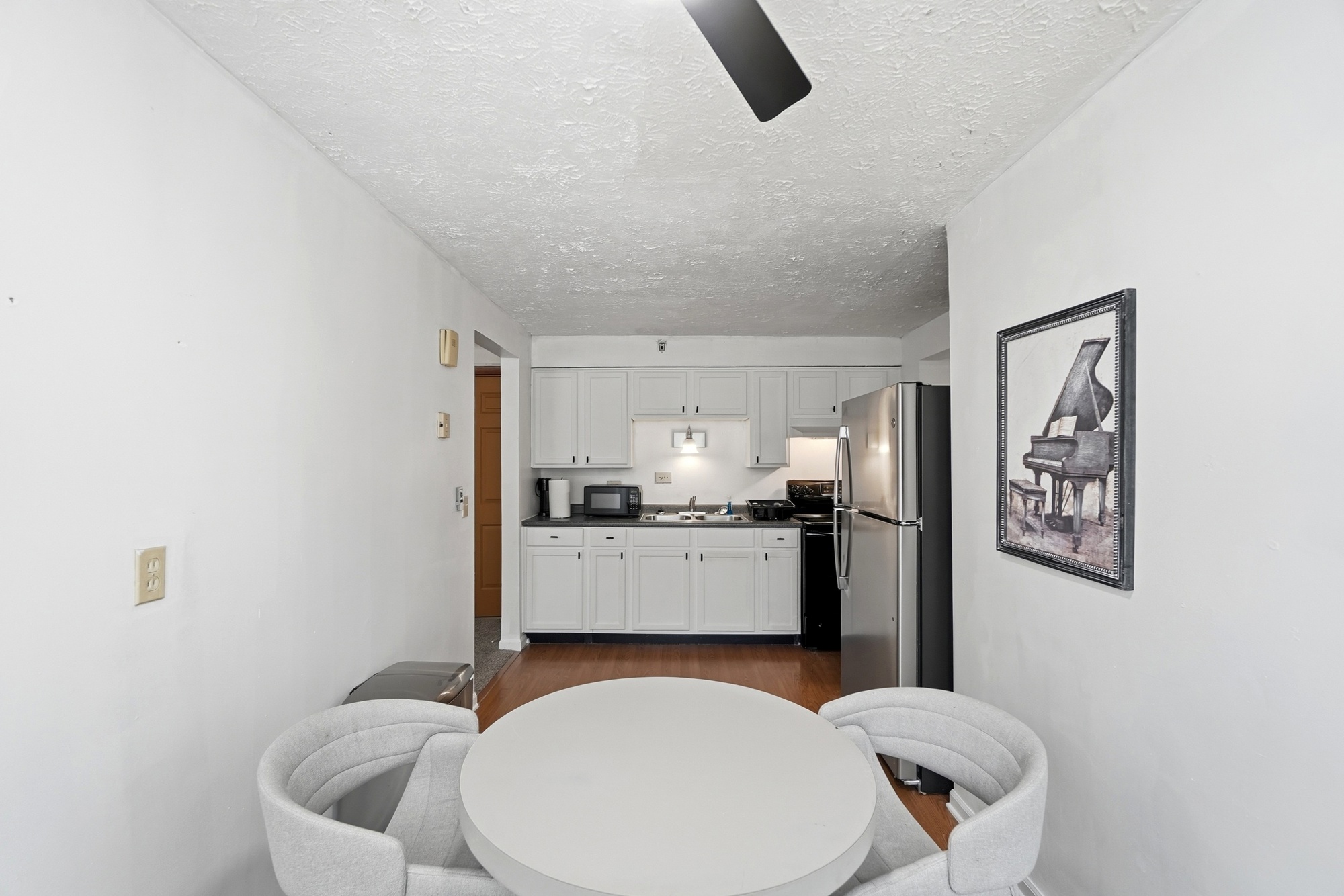 Bright dining nook with stylish seating and an open kitchen layout