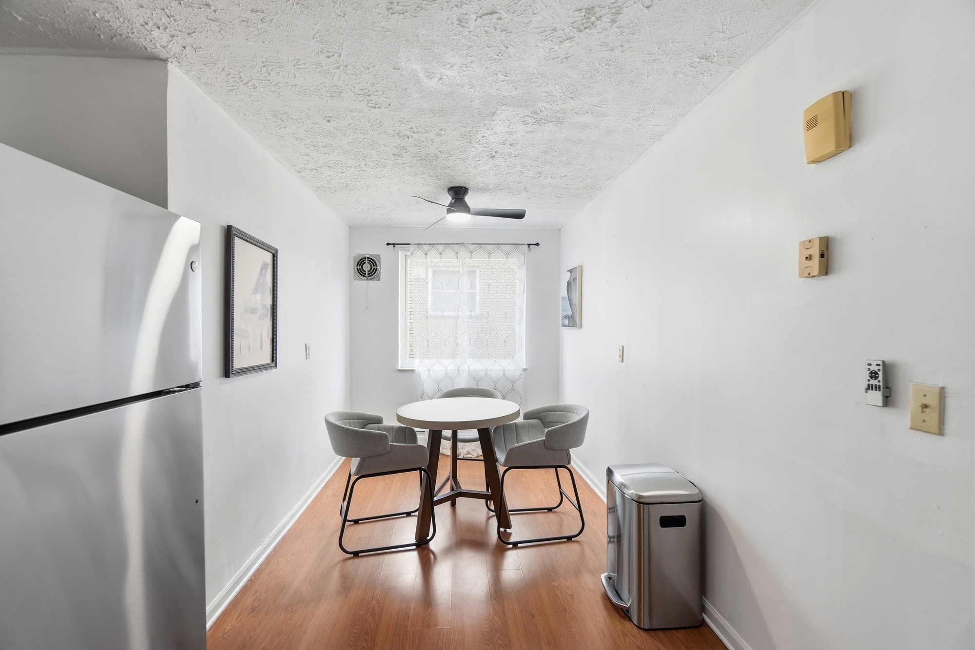 Bright dining nook with natural light, cozy seating, and modern essentials