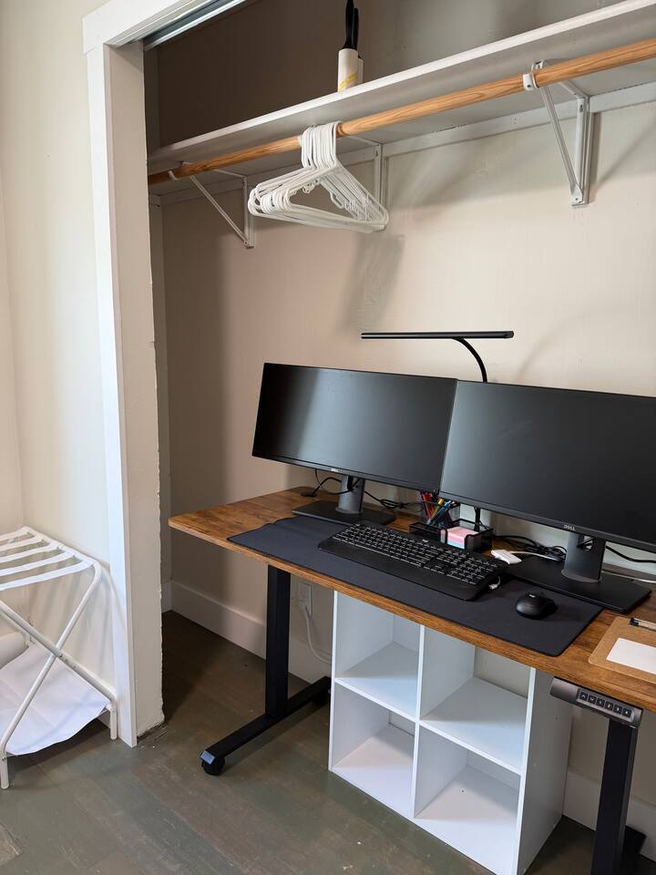 Portable desk with dual monitors and stationary