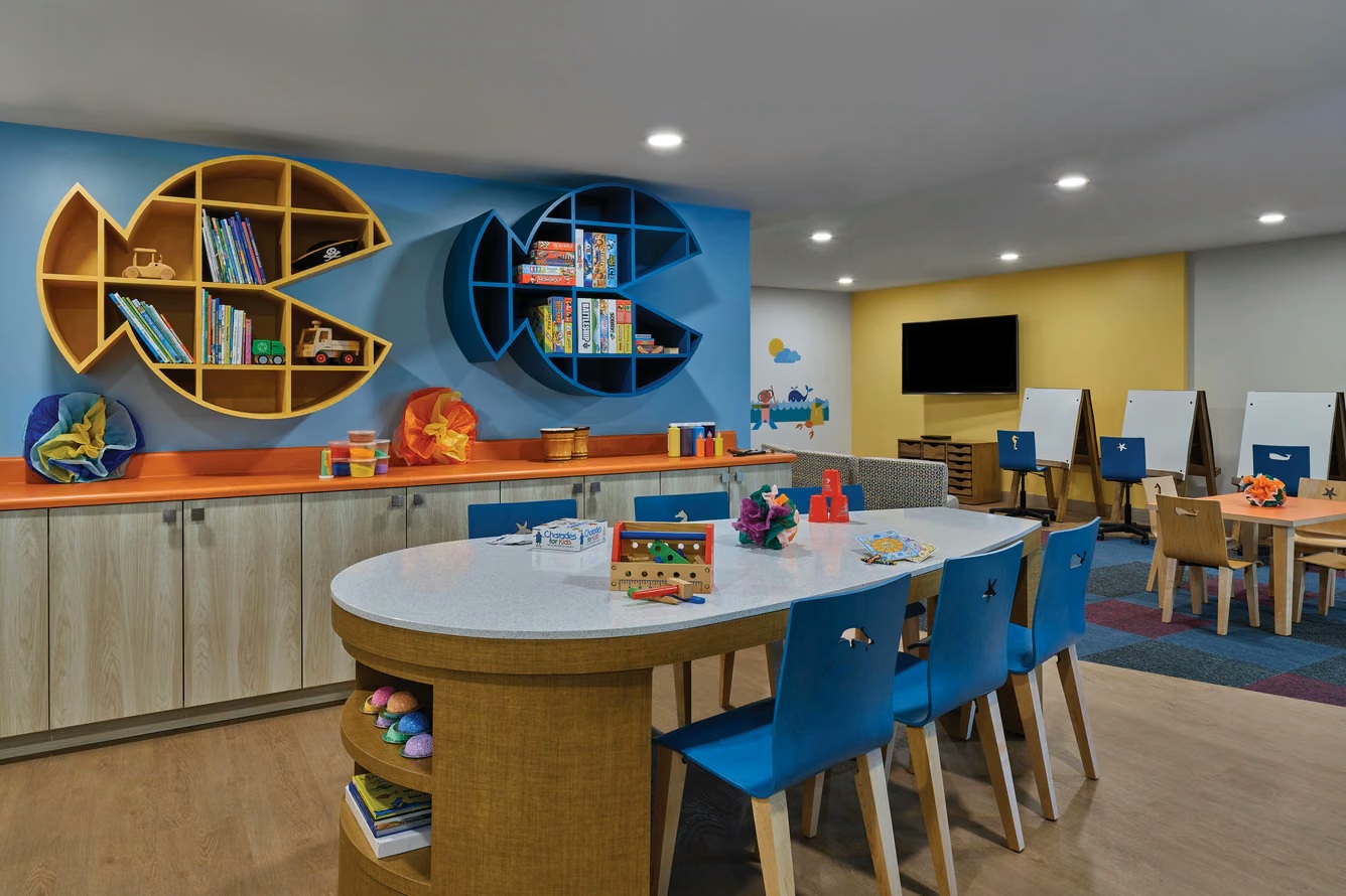 Colorful kids’ playroom with crafts, games, easels, and family-friendly fun