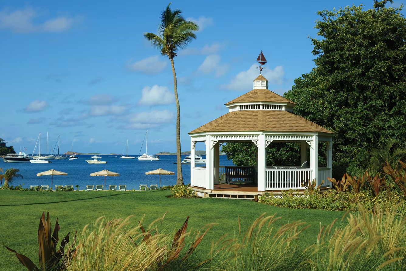 Charming waterfront gazebo with lush lawn and serene bay views