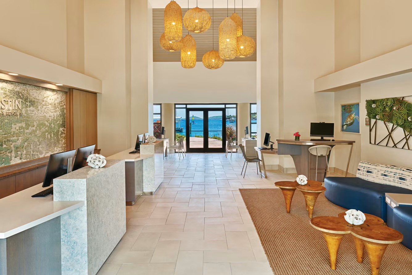 Stylish open-air lobby with soaring ceilings and stunning ocean views