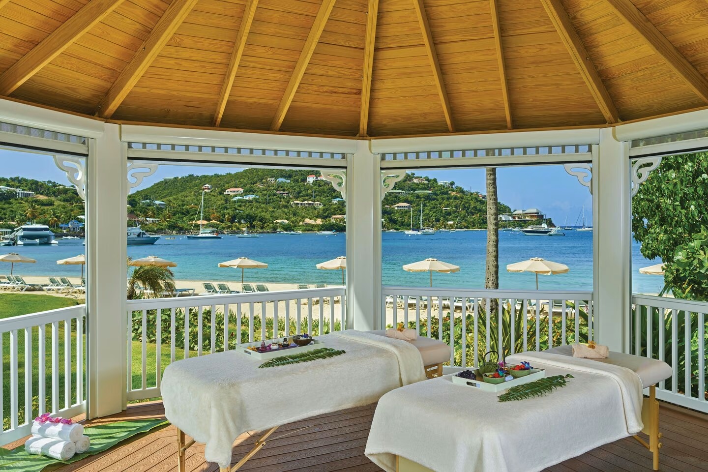 Open-air spa pavilion with stunning waterfront views and tropical charm