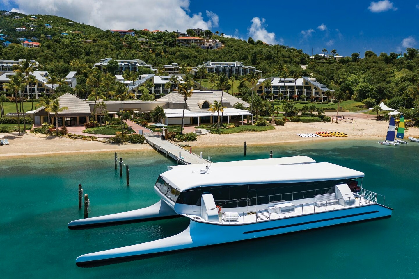 Beachfront resort with turquoise water and private catamaran views