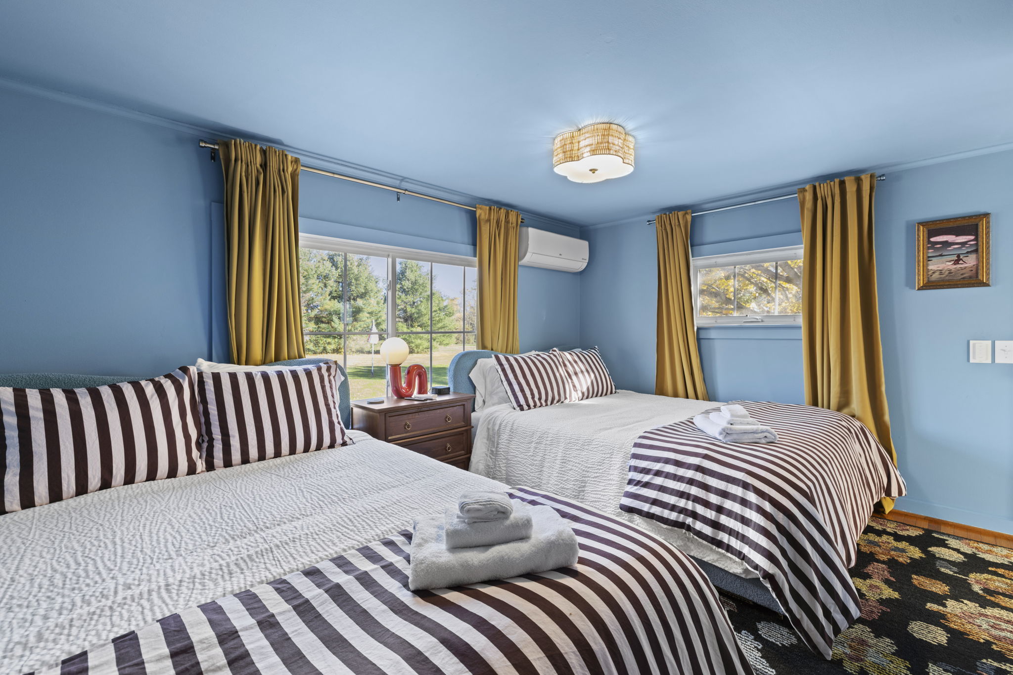 Bright double bedroom with two comfy beds and natural light