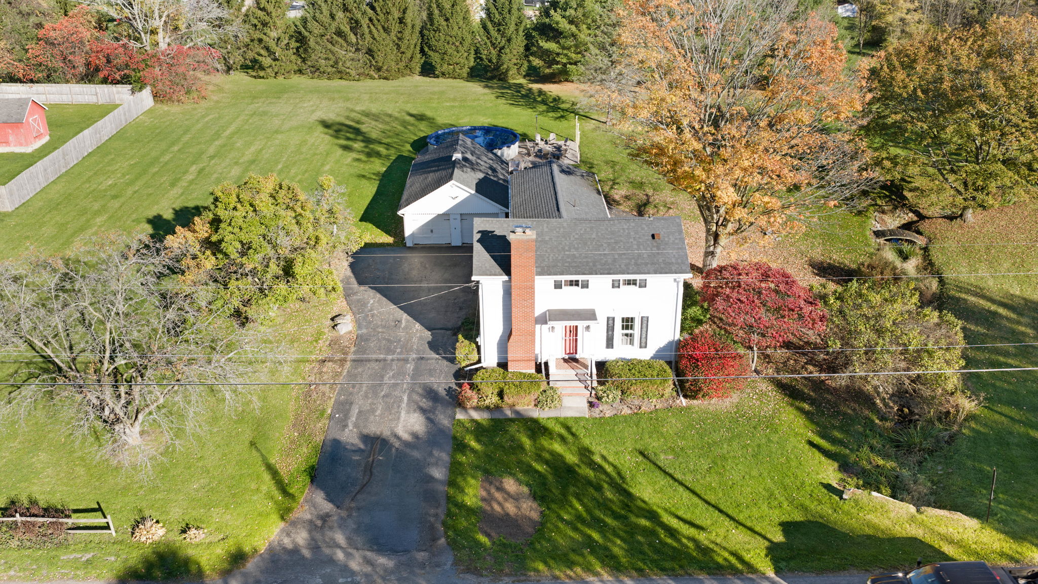 Charming country home with expansive yard, mature trees, and private setting