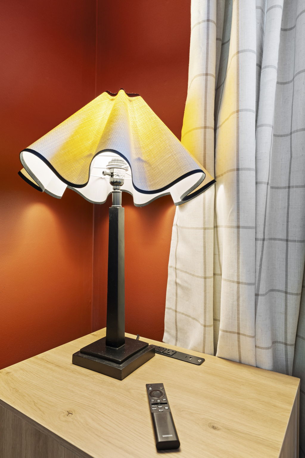 Cozy designer lamp corner with warm lighting and modern bedside style