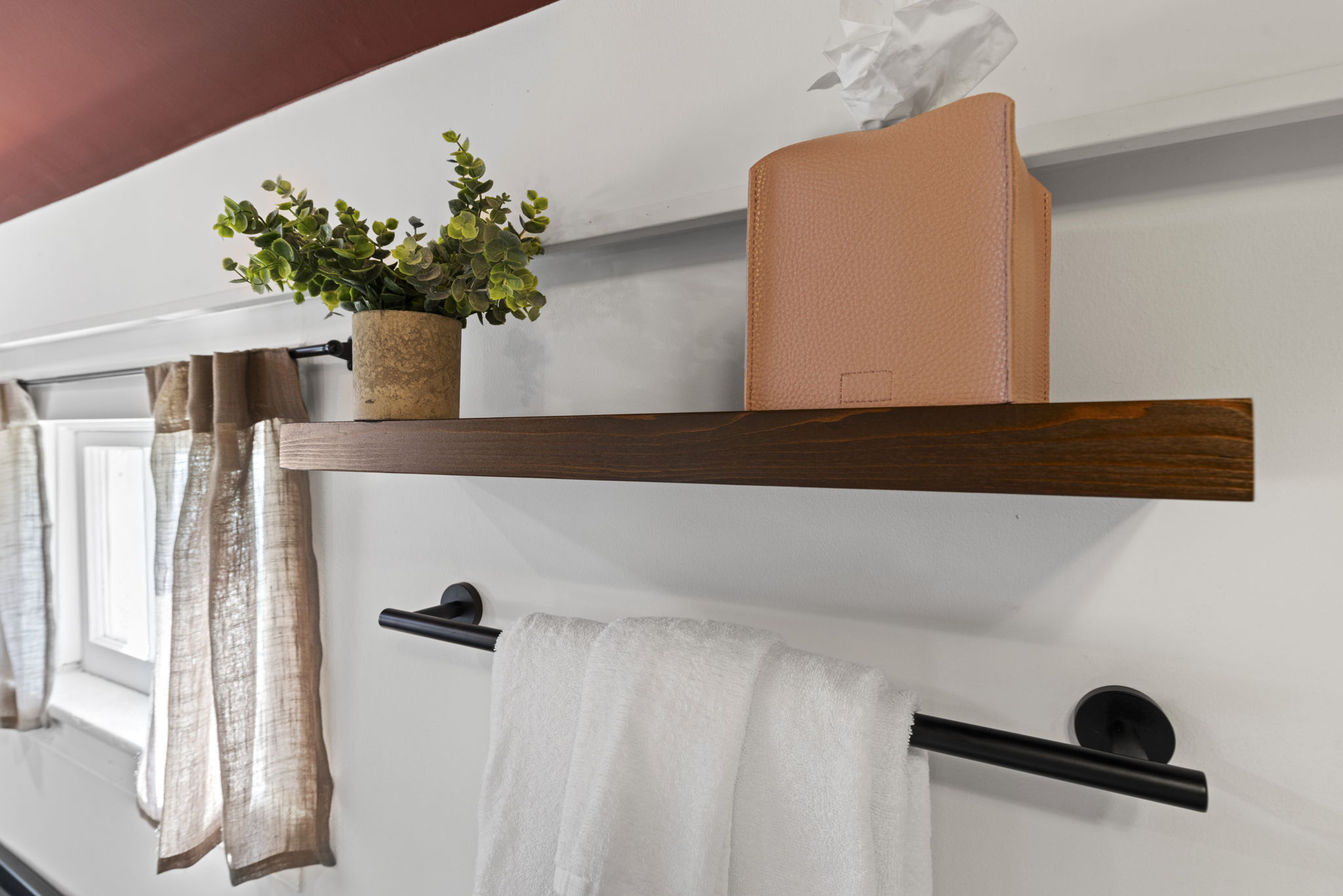 Stylish bath details with floating shelf, soft light, and modern finishes
