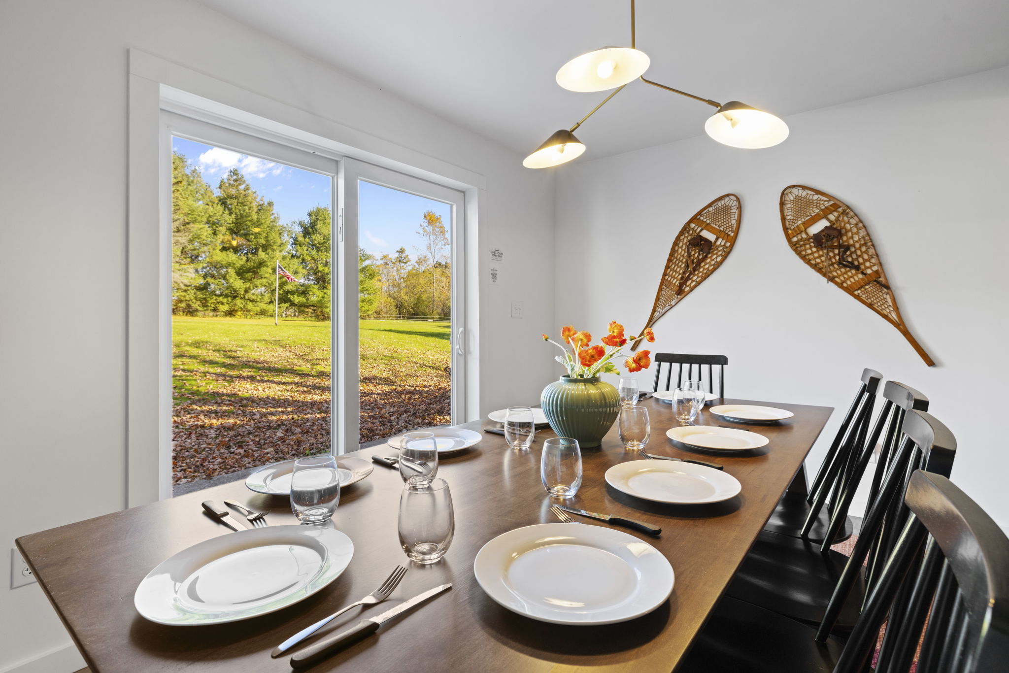 Bright dining room with yard views and seating for the whole group