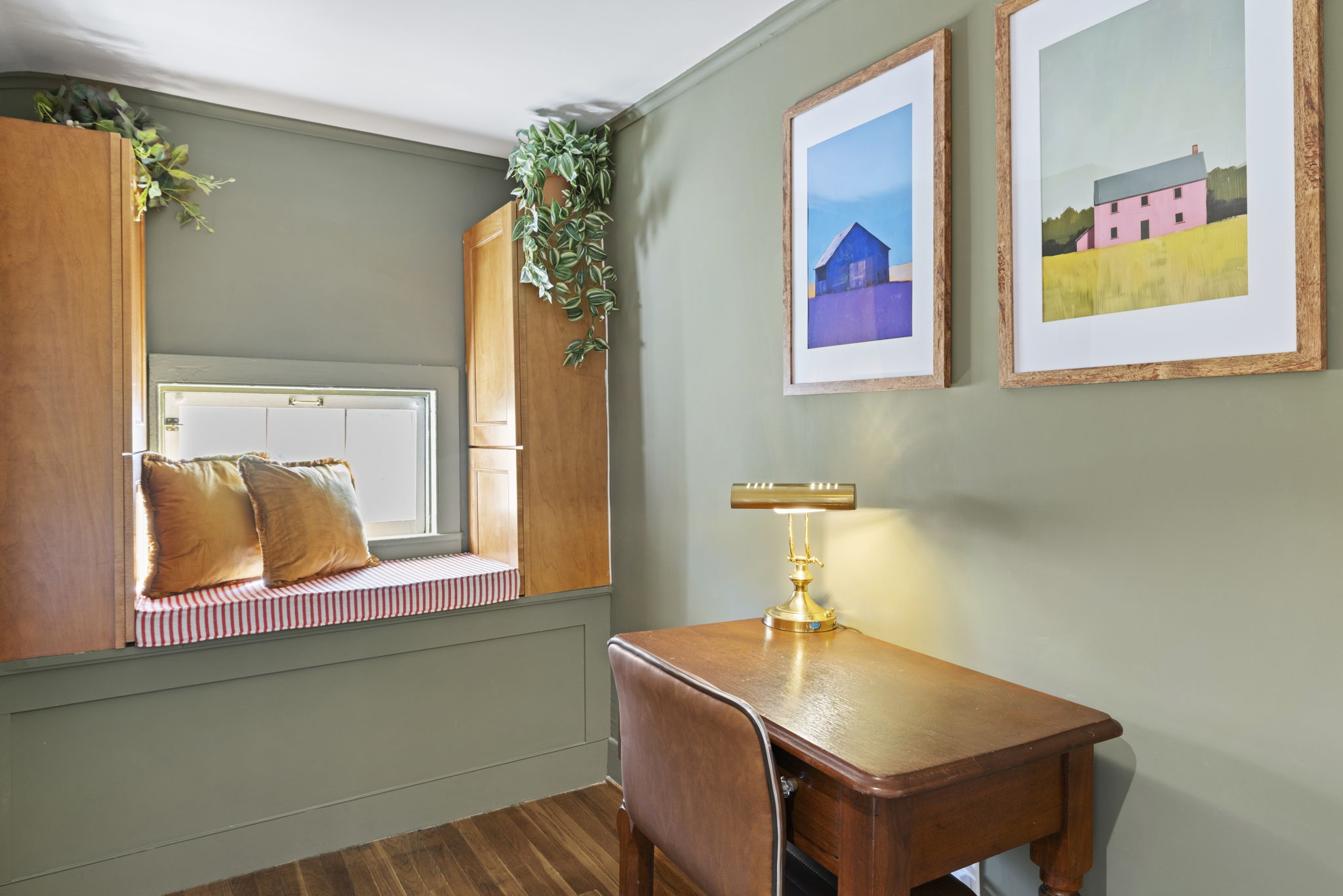 Charming reading nook with desk, window seat, and elegant vintage touches