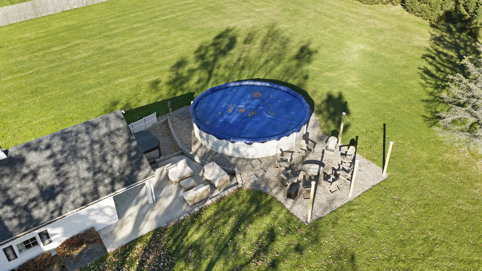 Spacious backyard with pool, patio dining, and plenty of room to relax