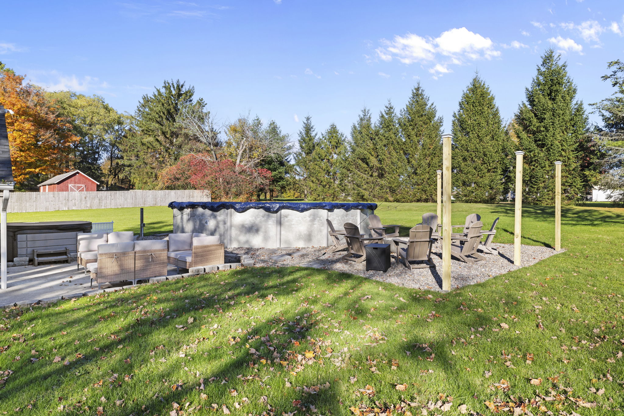 Private backyard oasis with pool, hot tub, and cozy outdoor seating