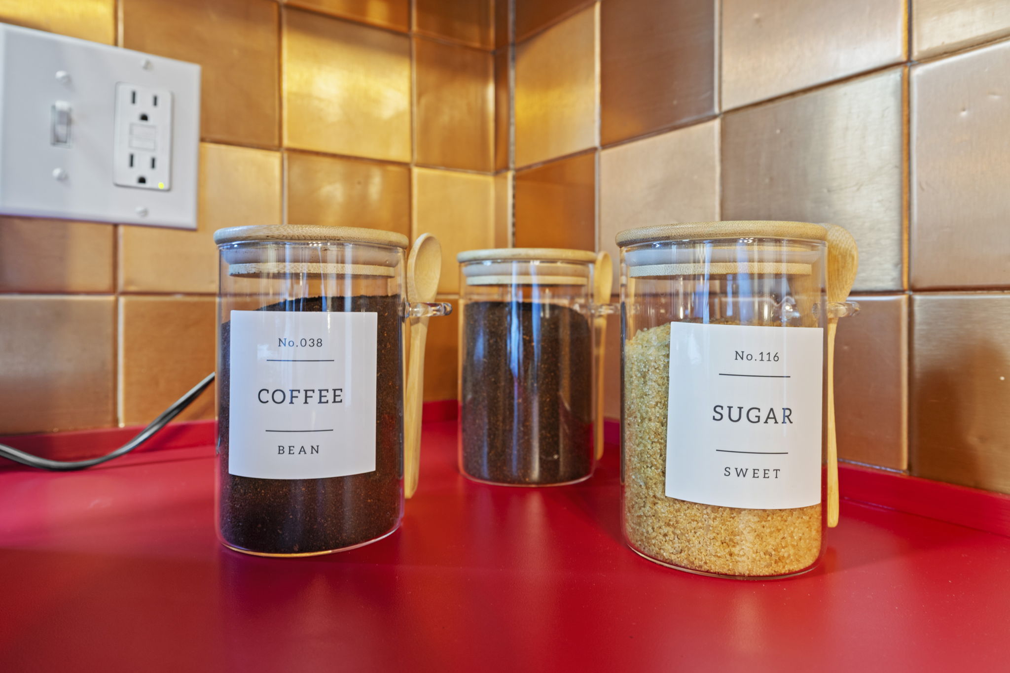 Stylish coffee station with organized canisters and bold designer finishes