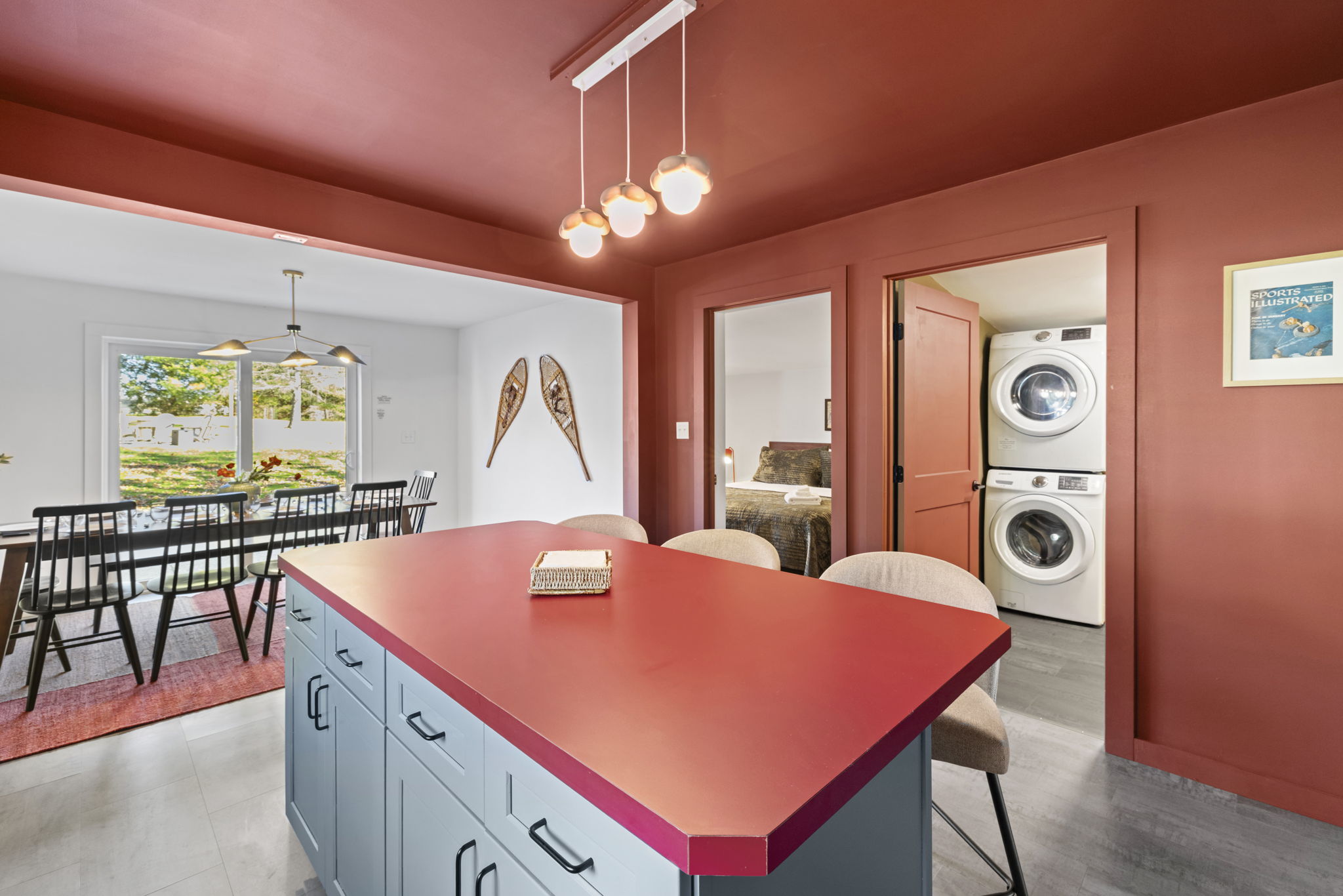 Bold kitchen island, sunny dining area, and in-unit laundry