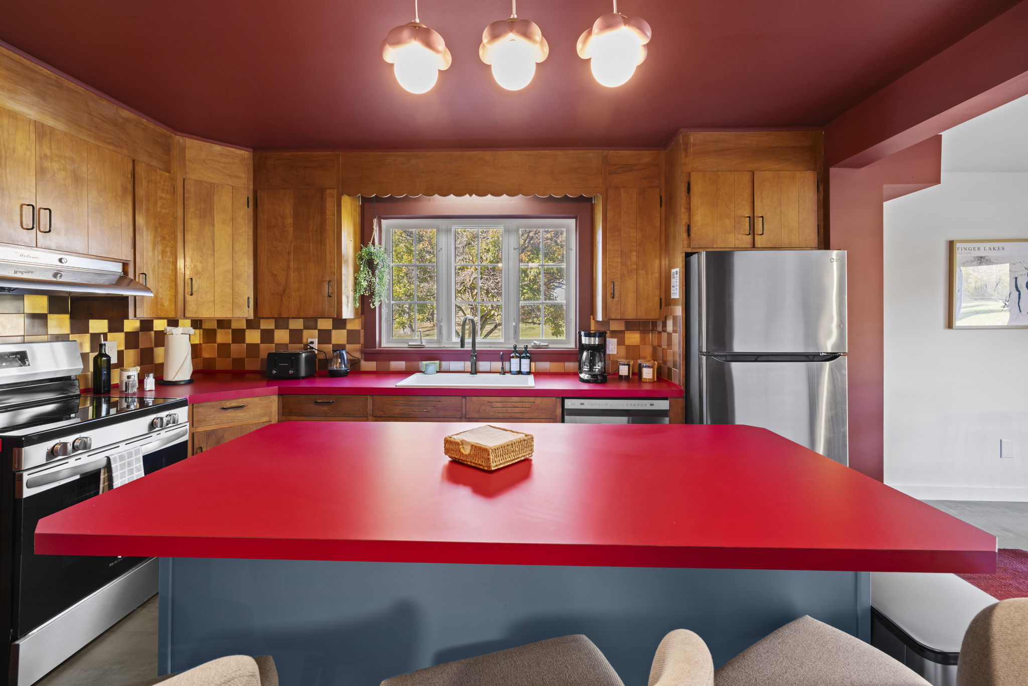 Bold, spacious kitchen with large island and warm vintage charm