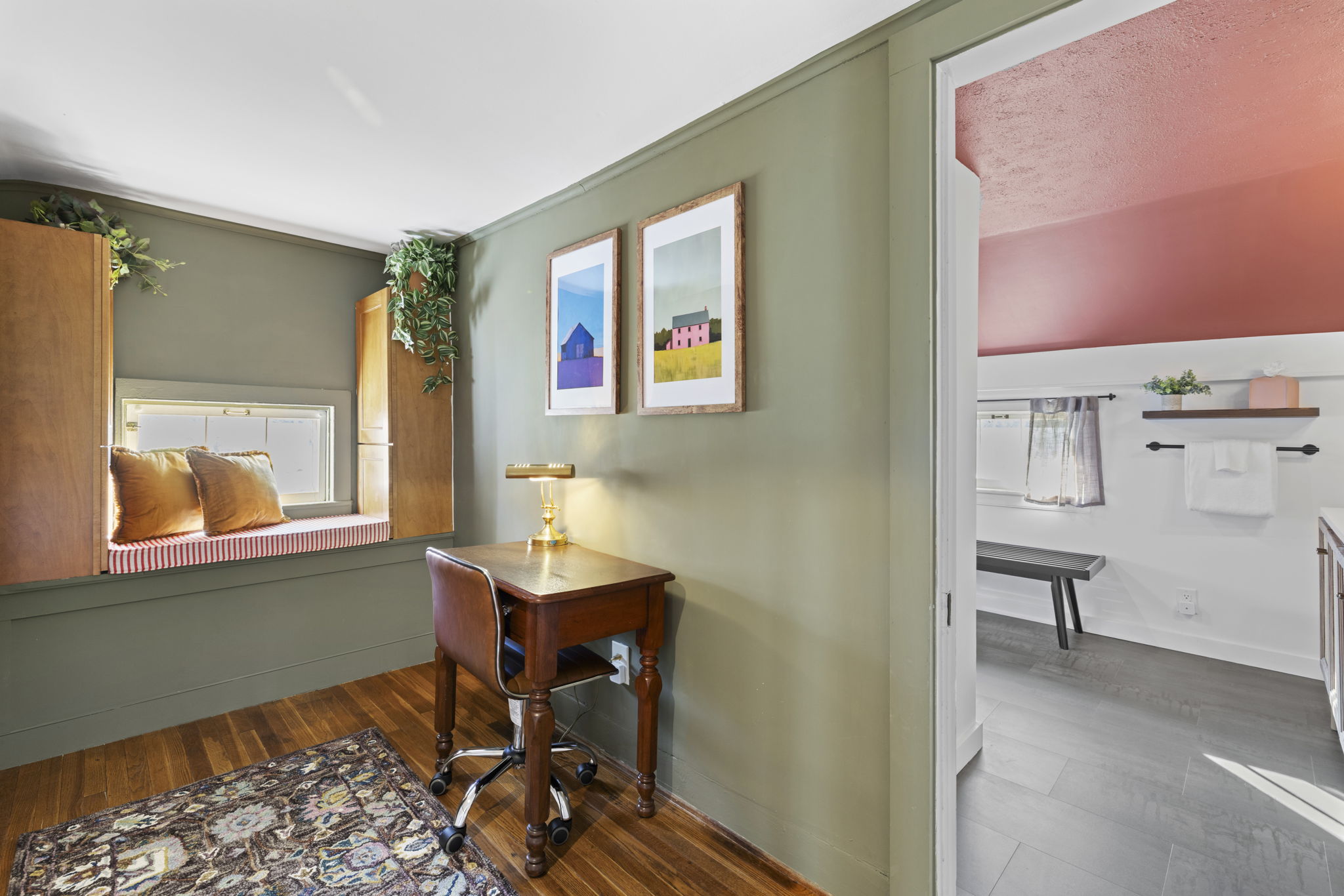 Charming reading nook with desk and bright ensuite bath