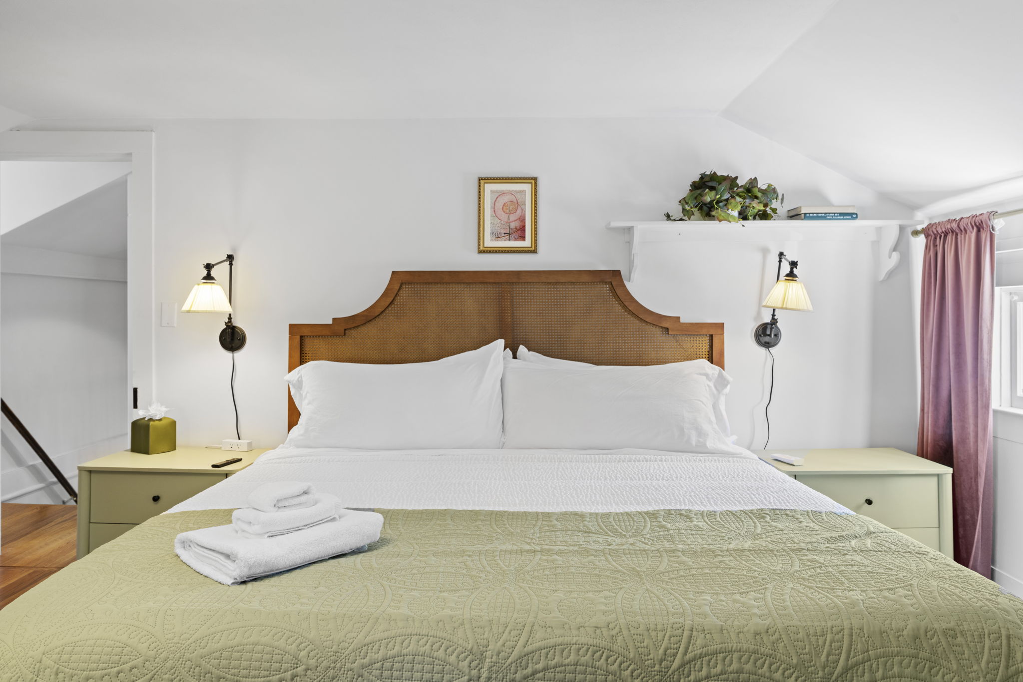 Bright, cozy bedroom with king bed, reading lights, and crisp linens