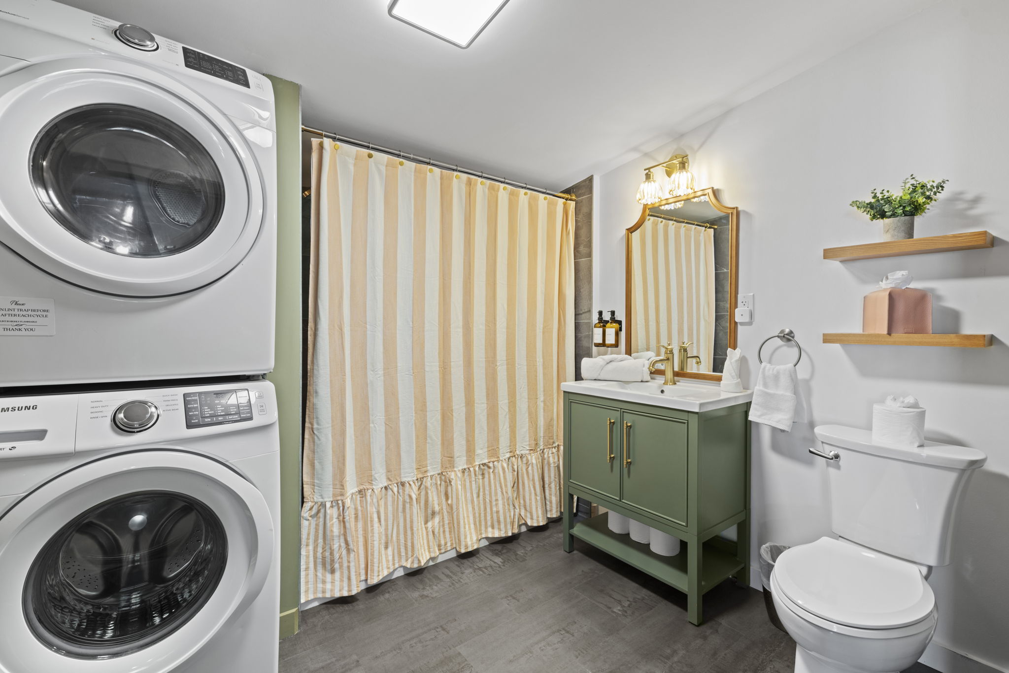 Stylish full bath with in-unit washer/dryer and elegant finishes