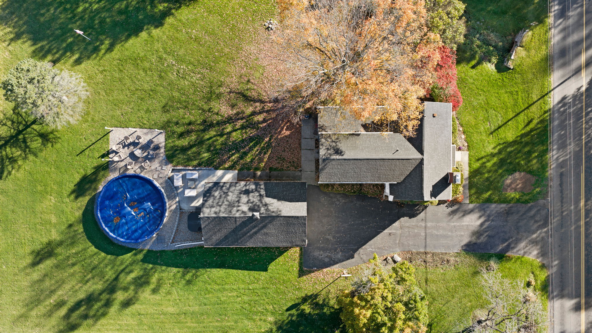 Aerial view with pool, patio, and expansive private yard