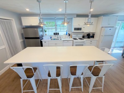 Bright modern kitchen with large island seating for 5