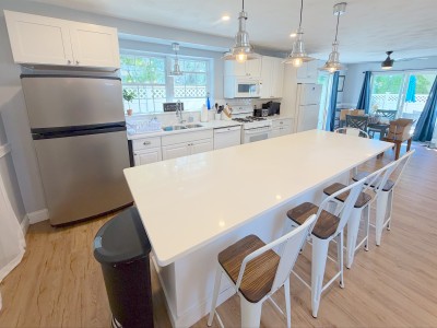 Bright open kitchen with oversized island seating for 4