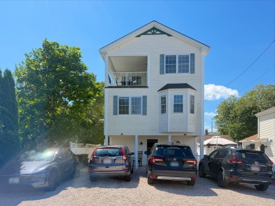 Sunny elevated home with balcony and ample off-street parking