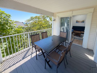 Covered treetop balcony with outdoor dining for six and easy indoor access